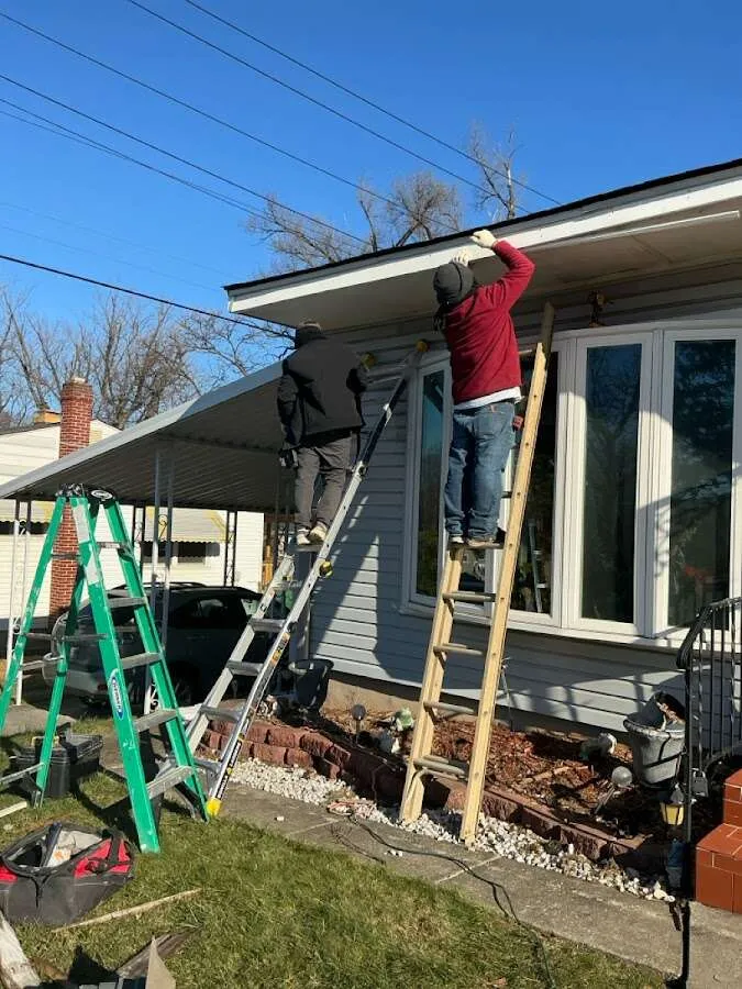 Restoration crew performing exterior repair in Davison